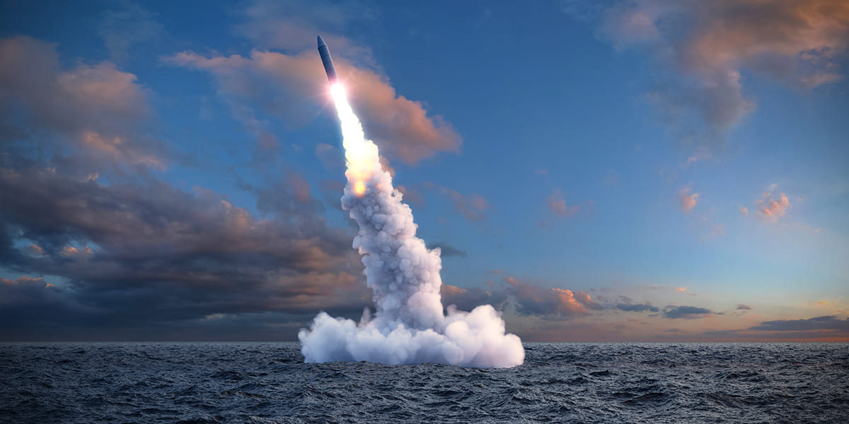 A missile launch from the sea, representing a Fortune 500 defense contractor client in a Strategic Benefits Advisors case study on claims auditor selection.