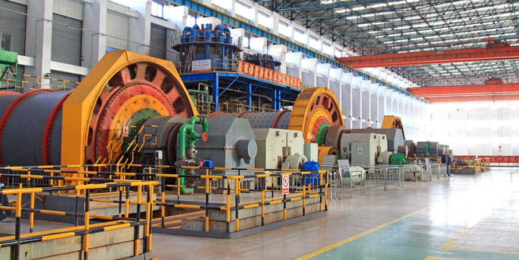 Strategic Benefits Advisors case study regarding repairing DC plan administration errors for a global electronics manufacturer, showing massive industrial machinery and processing equipment inside a manufacturing plant.